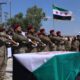 Rinden honores a militartes fallecidos tras explosión de depósito de armas en Siria